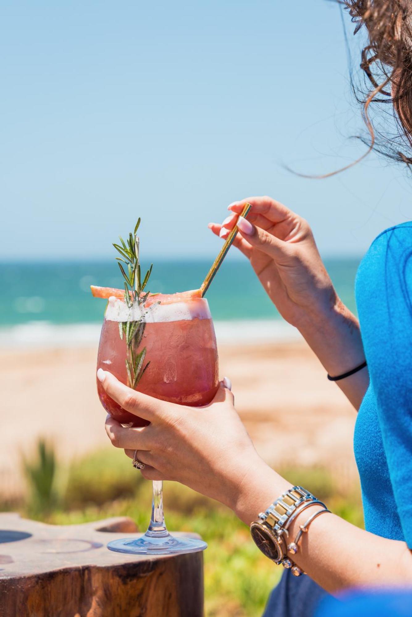 Hyatt Regency Taghazout Hotel Exterior photo A woman using a reusable straw